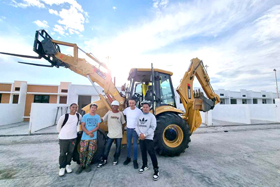 Backhoe loader working on a construction site in the Philippines