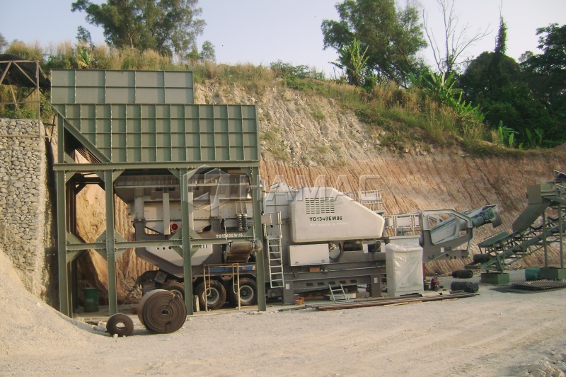 Wheeled mobile crushing plant working on a highway project