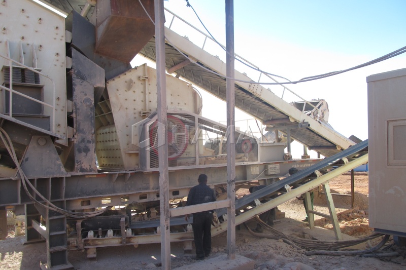 Algeria crushing plant close view of impact crusher and conveyors