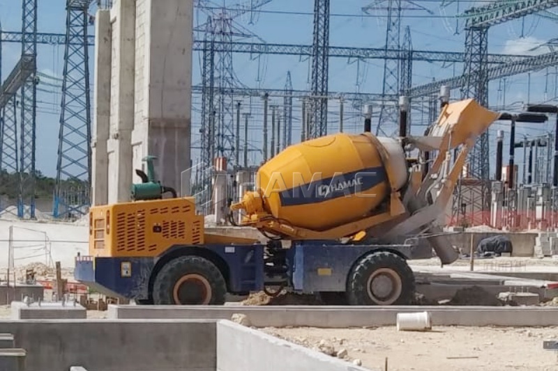 Self-loading concrete mixer