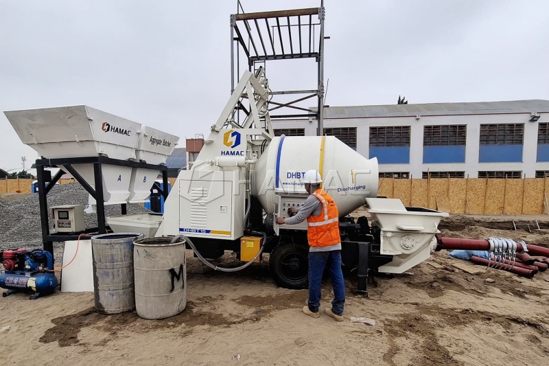 Trailer concrete mixer pump working at a construction site